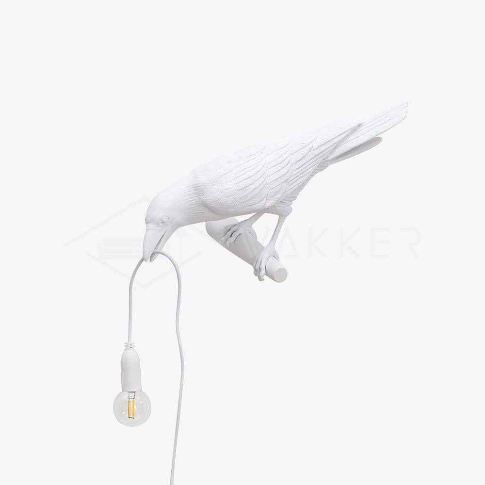 White bird with exposed hanging bulb