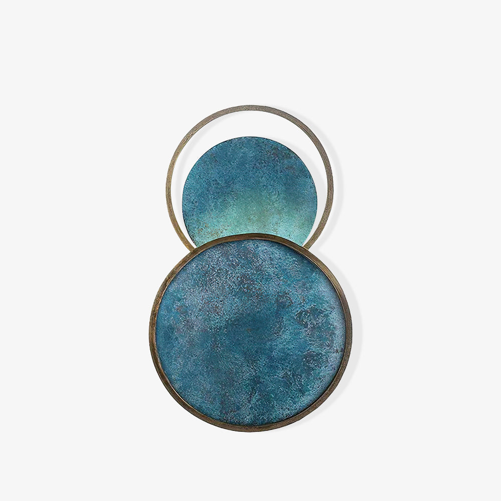 White-background view of textured turquoise circular faces, weathered edging and open upper ring on one wall-light fixture.