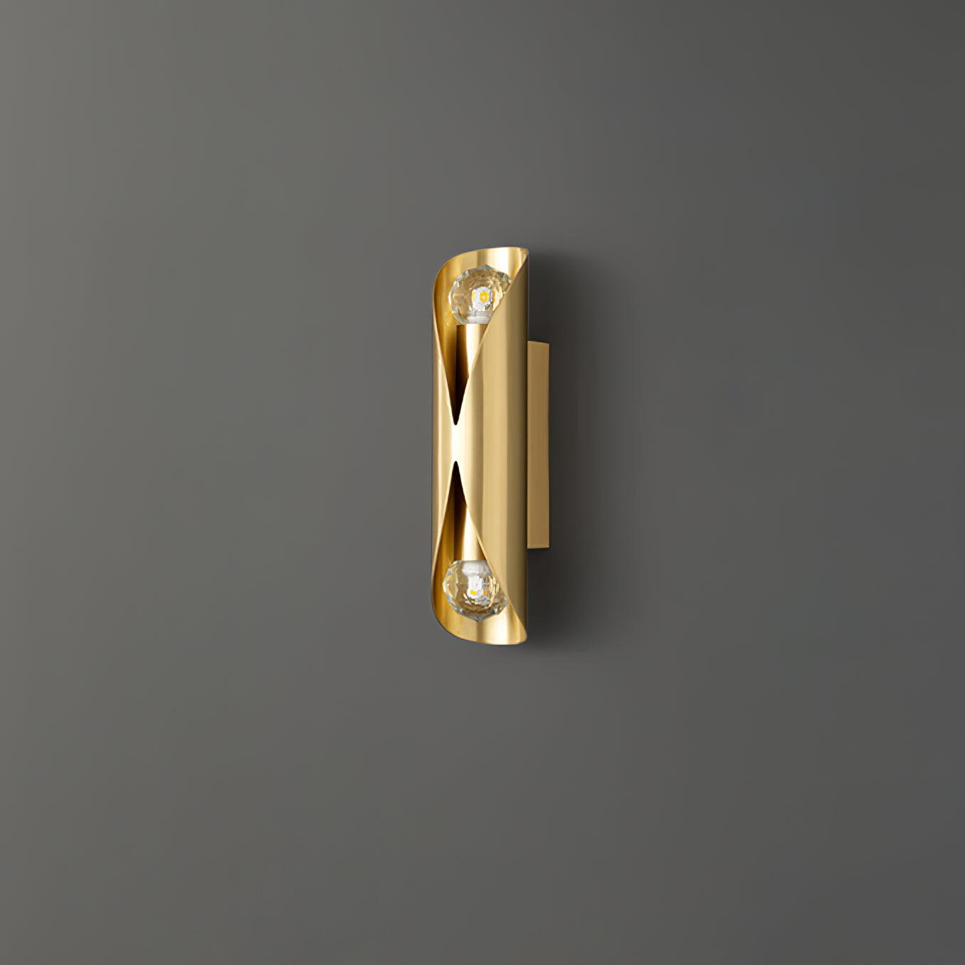 Unlit Brass wall light on a dark background