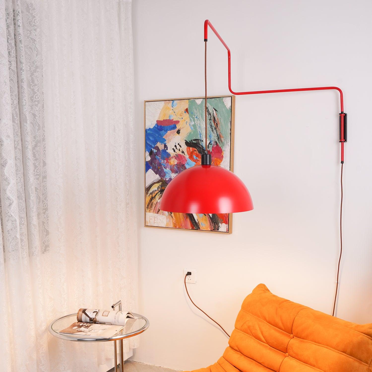 Red wall arm extended above an orange sofa
