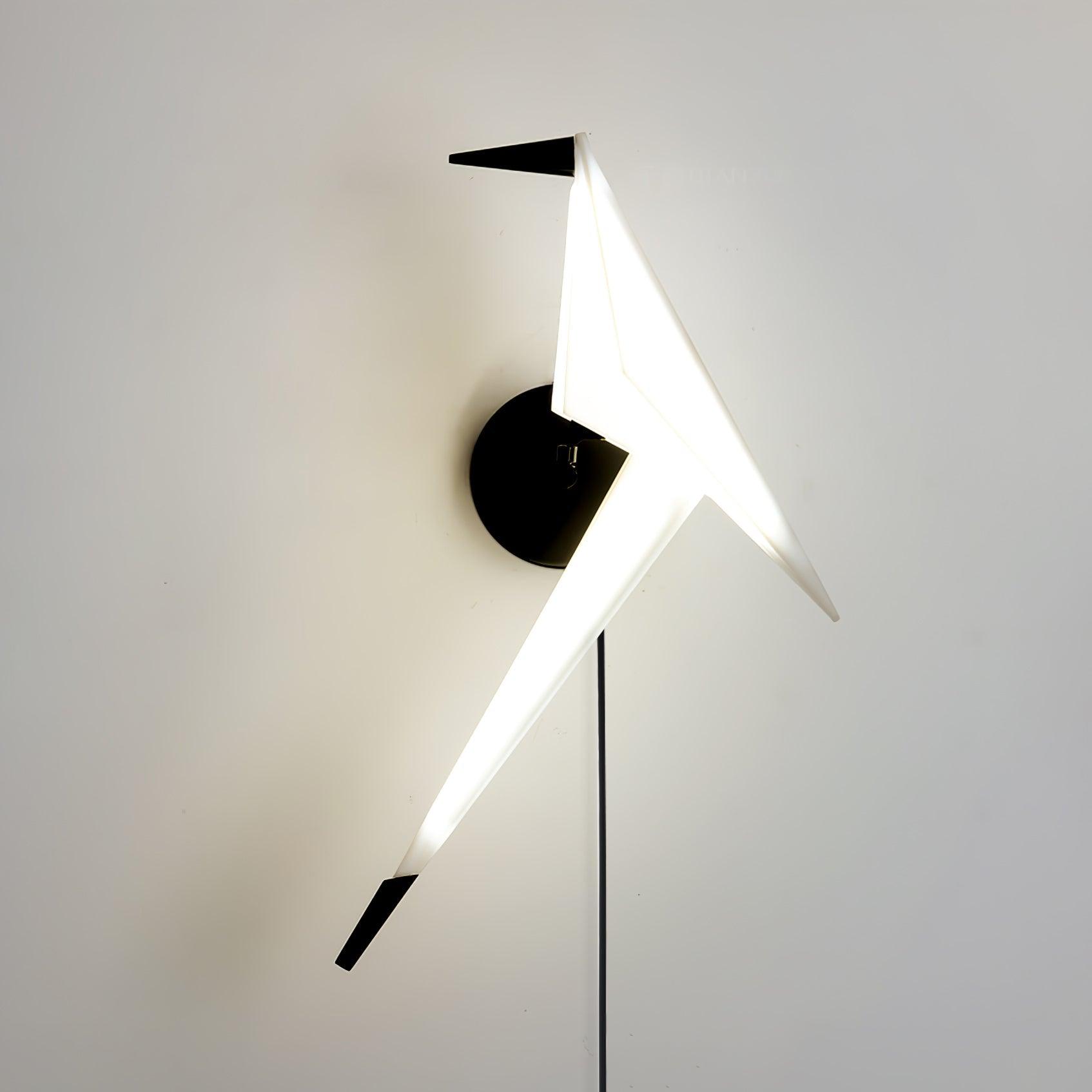Glowing White bird wall lamp with Black beak, tail tip and round backplate, with a Black cable below