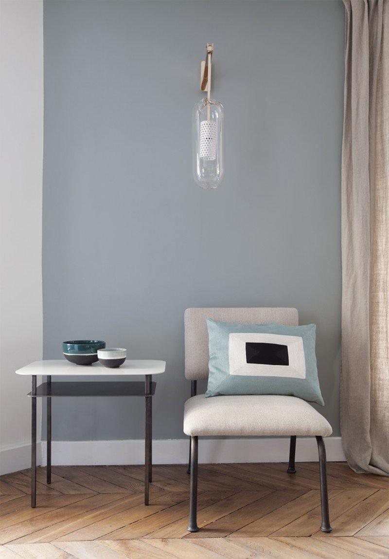 Glass sconce in a grey seating area