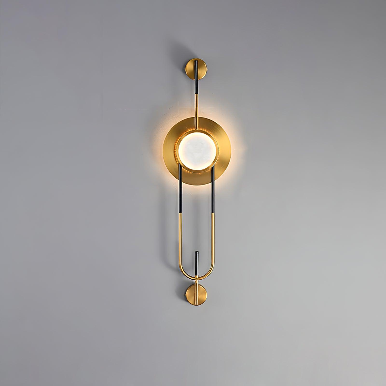 56 cm Circular Marble wall light lit against gray, with a short lower stem and loop-shaped frame