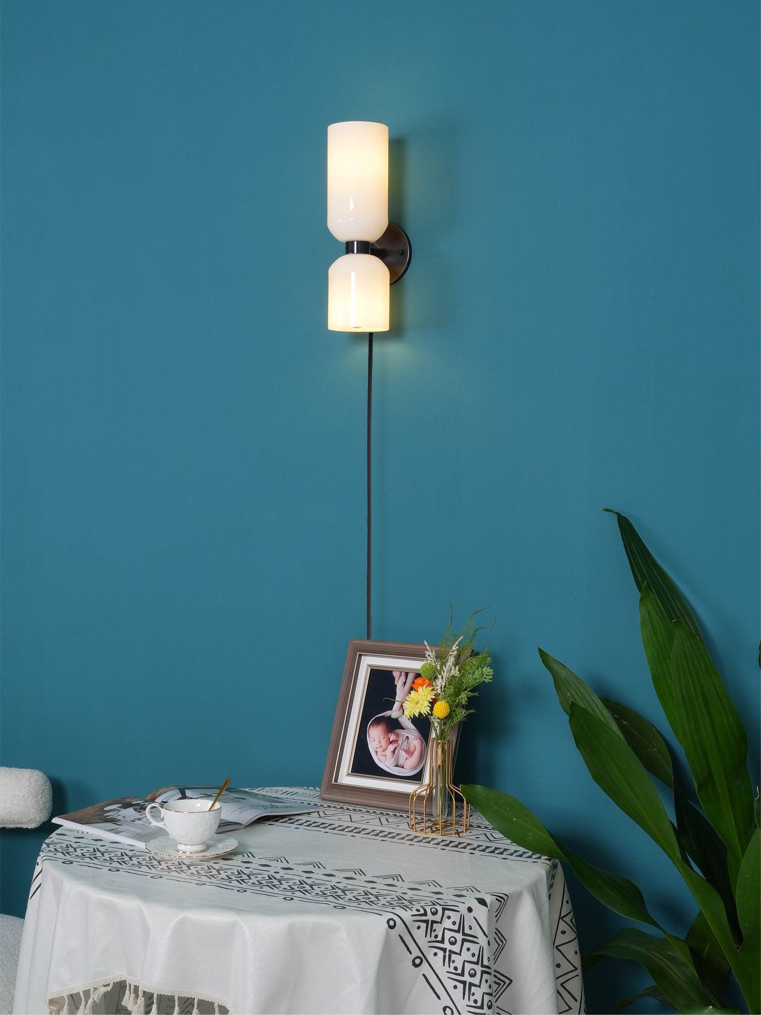 Corded Opal wall light in a blue room