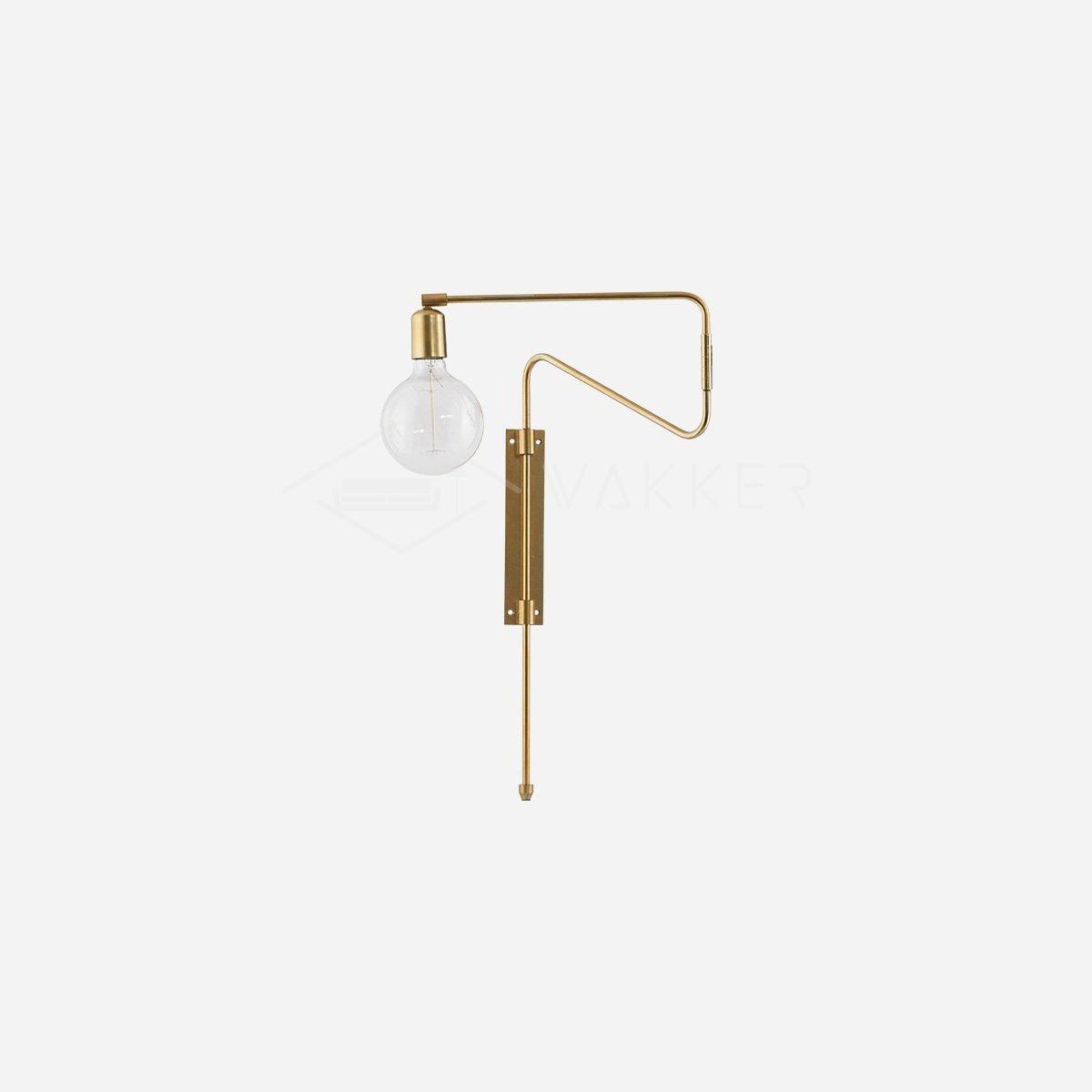 Brass folded Swing fixture on a plain background