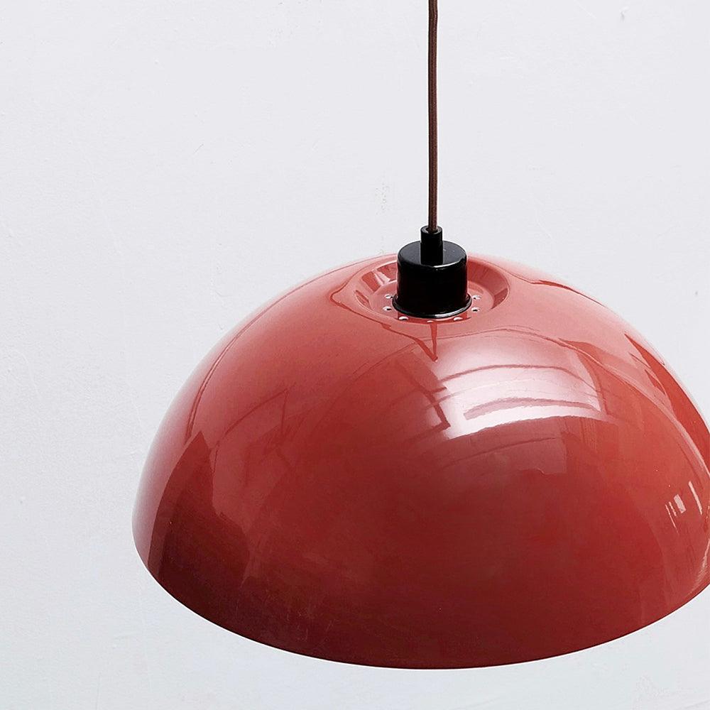 Shade suspension fitting and glossy red metal close-up