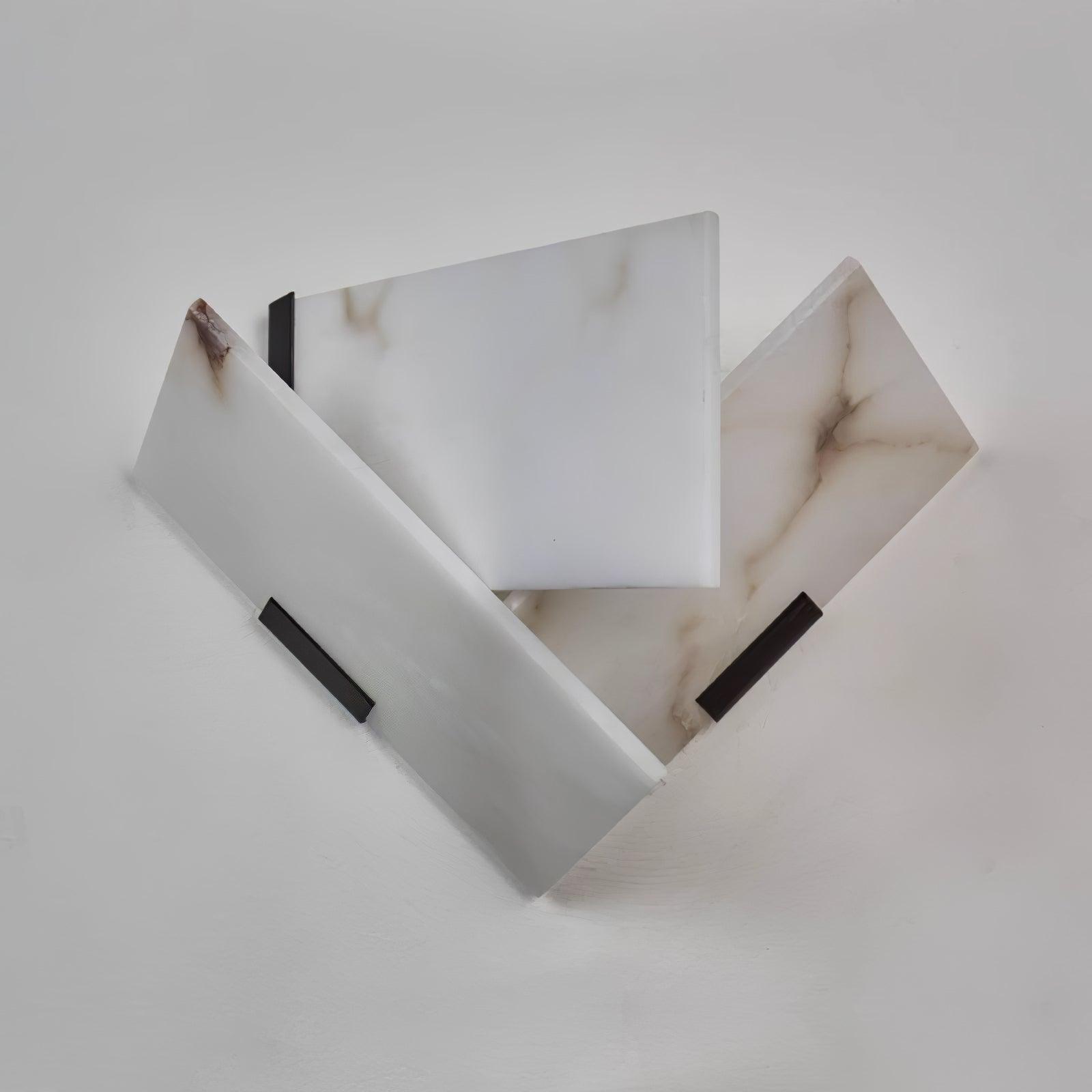 Unlit Left version Fly Alabaster sconce with white veined panels and a black rear edge on the left