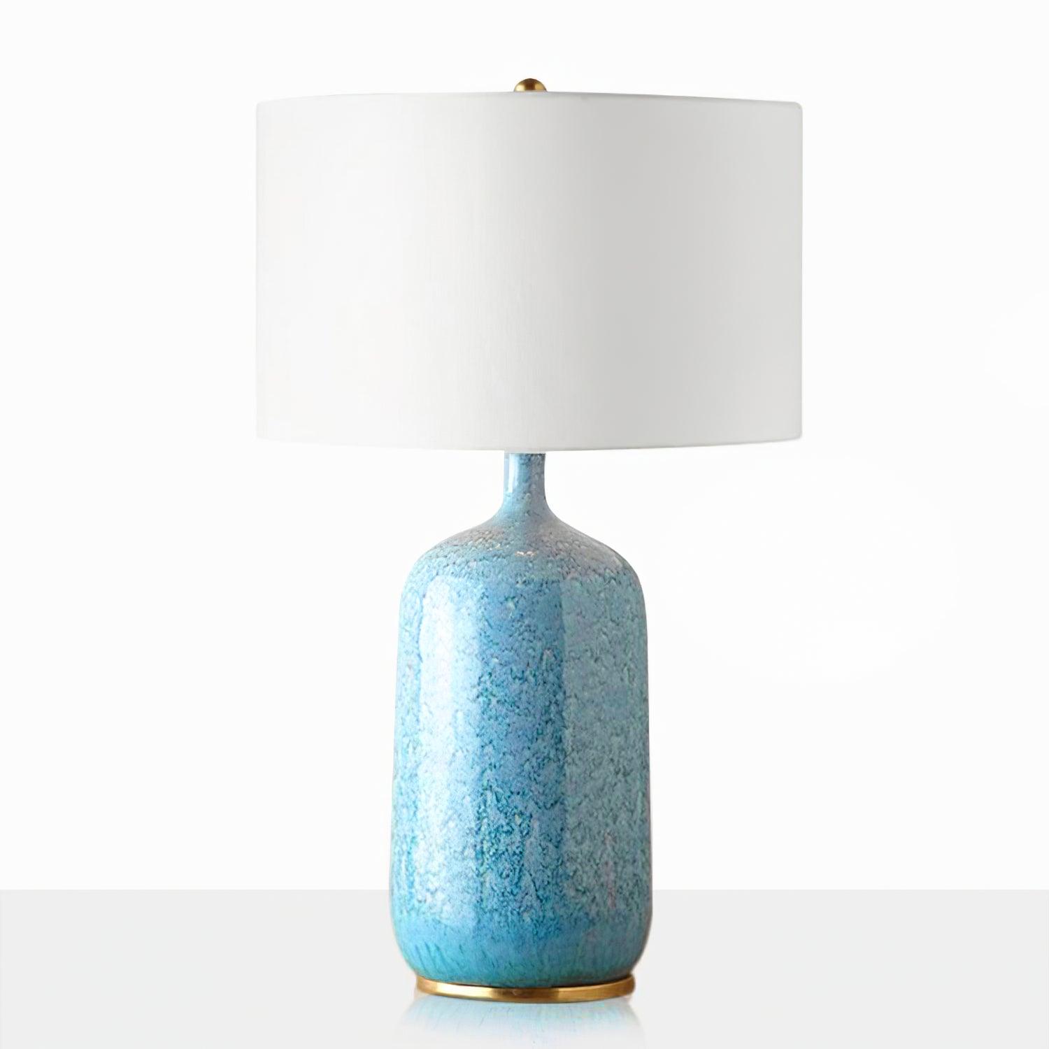 Front view of Culloden with blue bottle-shaped body and pale drum shade