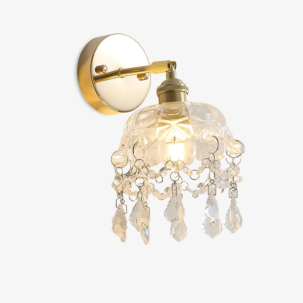 Full lit crystal tassel wall light on white, showing the patterned bell shade, drop fringe and gold-tone round wall plate