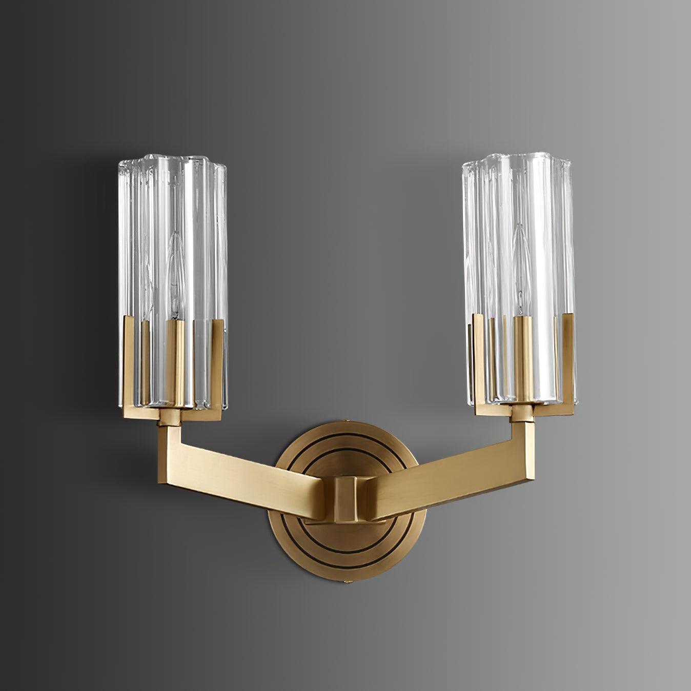 Frontal unlit twin-shade Kayla against grey background with clear glass cylinders, candle bulbs and brass ringed wall plate