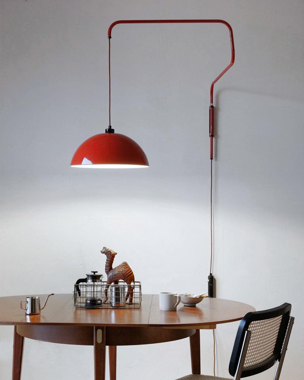 Red suspended dome above a round table