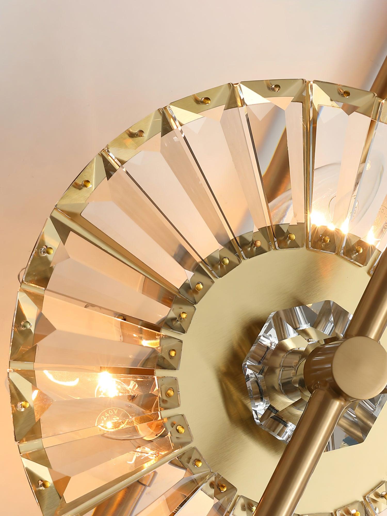 Close-up of faceted clear glass segments, small gold fasteners and lit bulbs behind the circular frame
