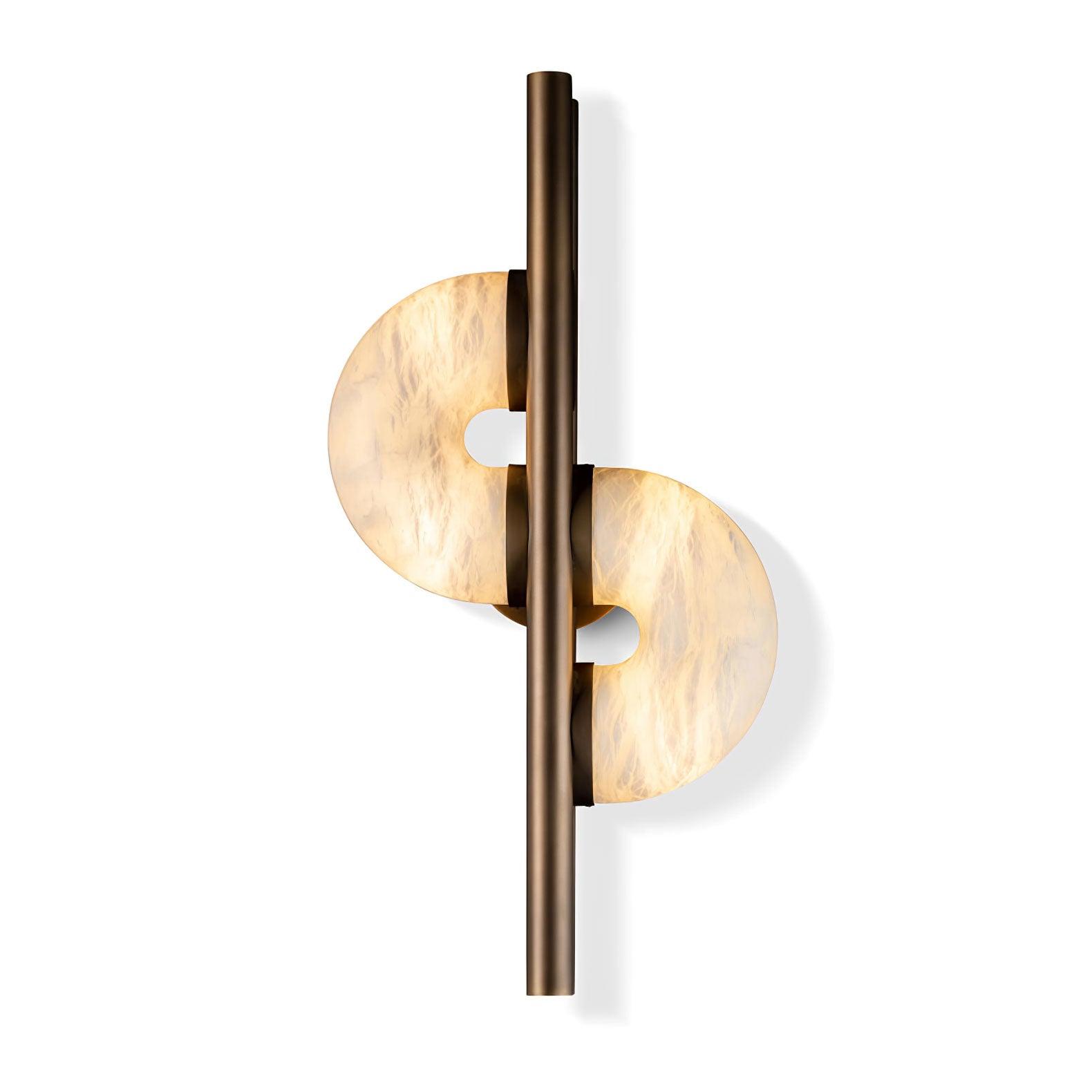 Isolated lit Dolly on white, showing notched upper-left and lower-right stone discs, long bronze bar and partial round rear plate