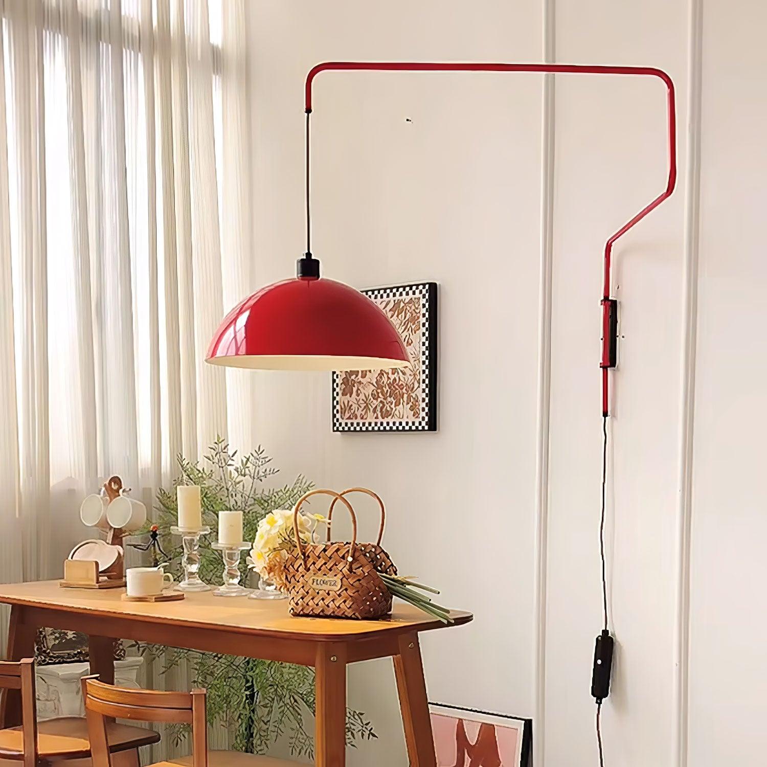 Red wall-mounted dome above a dining table