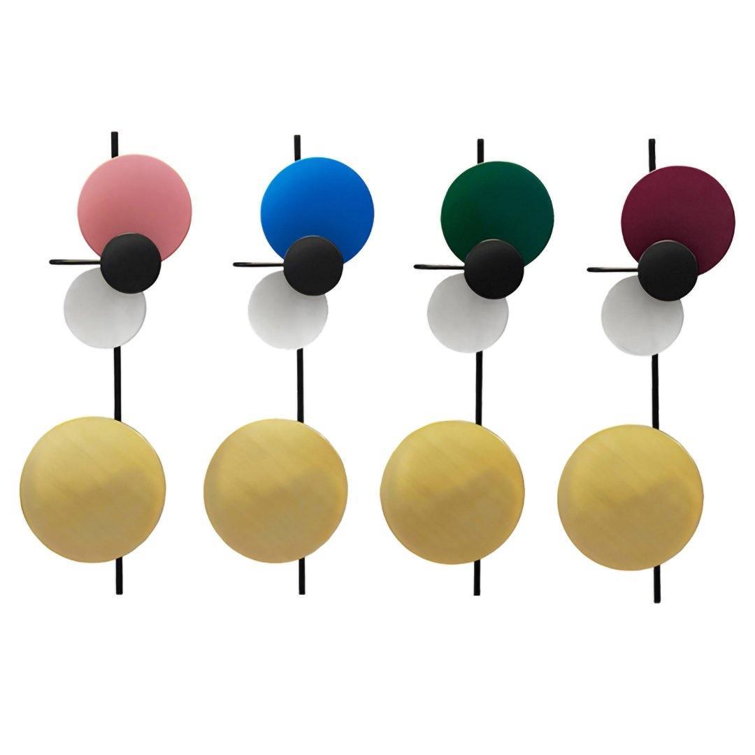 Four wall-light arrangements with pink, blue, green and plum upper discs