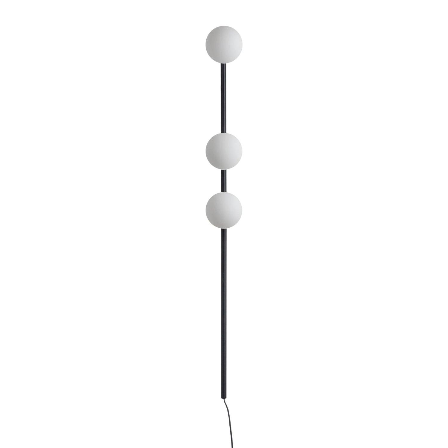 Black three-globe wall light isolated on white, unlit white glass globes along long black rod and black lower cord
