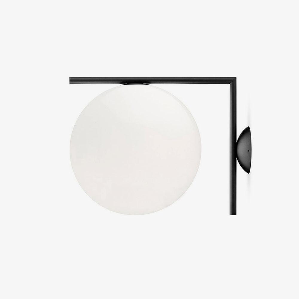 Opal glass globe wall light with a black angular frame and round wall plate