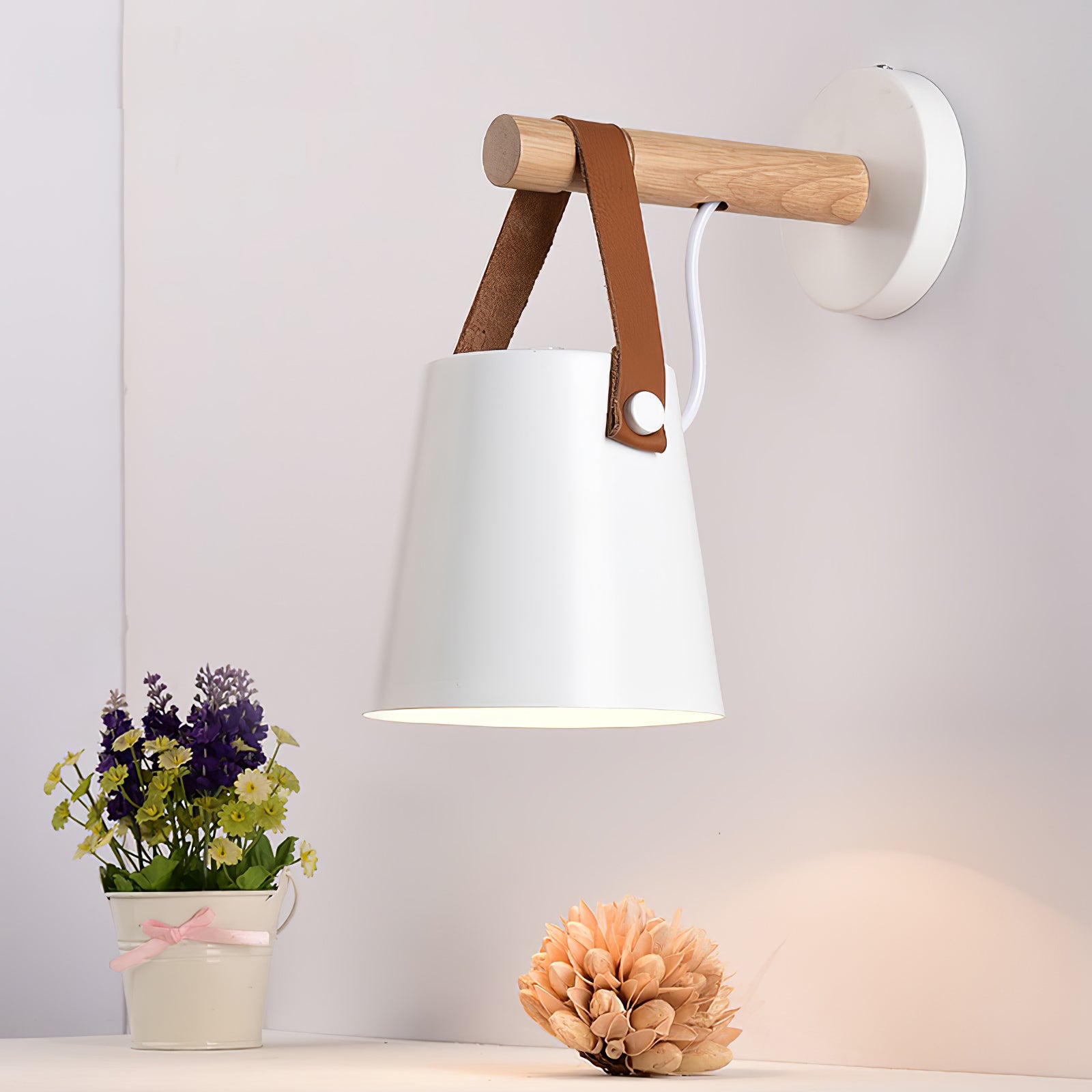 White strap-hung cone above flowers and a console
