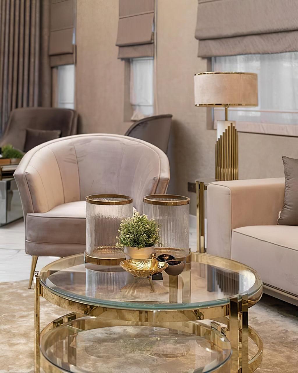Streamline Gold lamp behind a glass coffee table in a living room