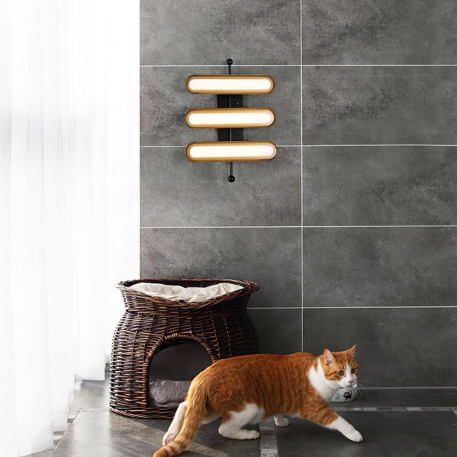 Three-bar gallery light above a basket and cat