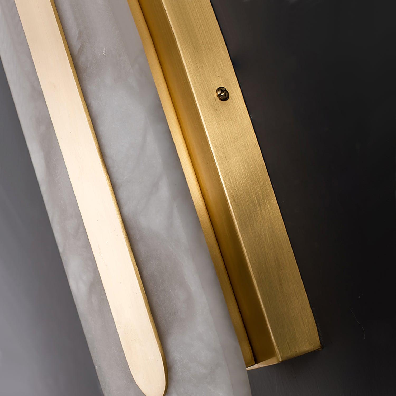 Side detail of stone panel and brass-coloured rear mounting plate