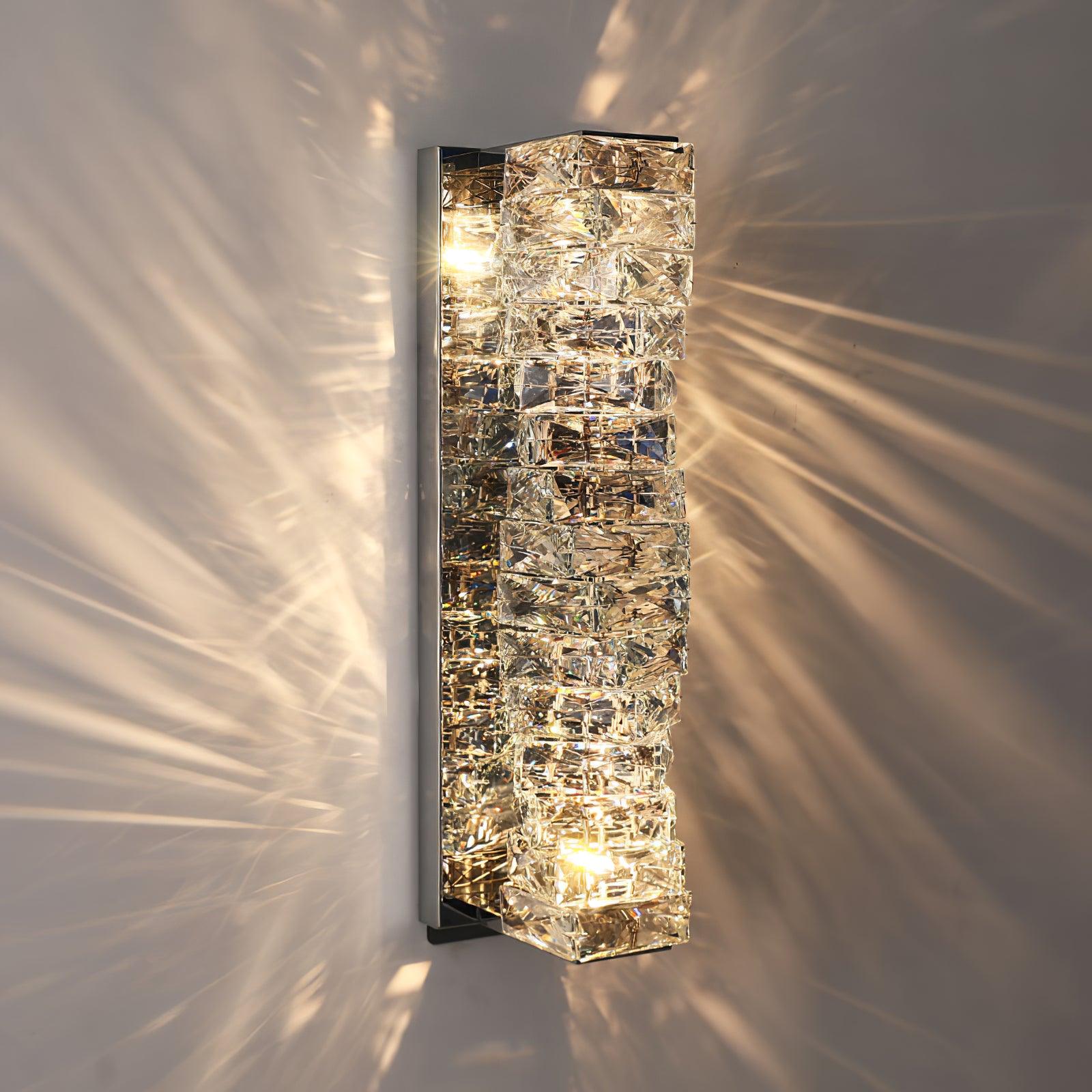 Tall Chrome crystal fixture casting visible wall patterns