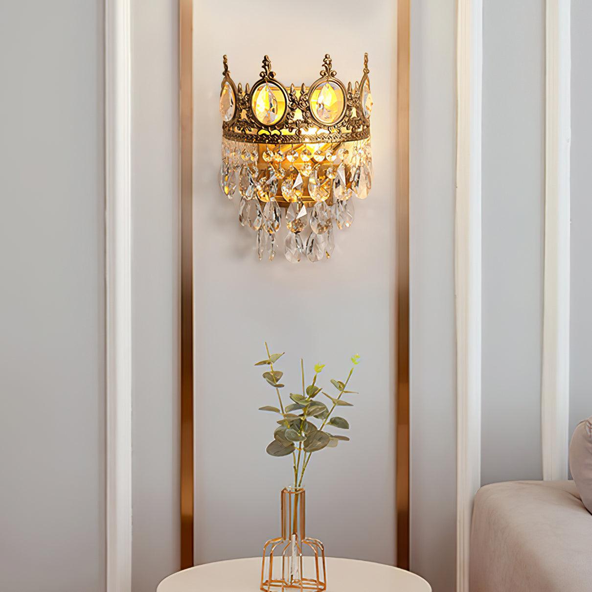 Crown-style crystal sconce above a side table