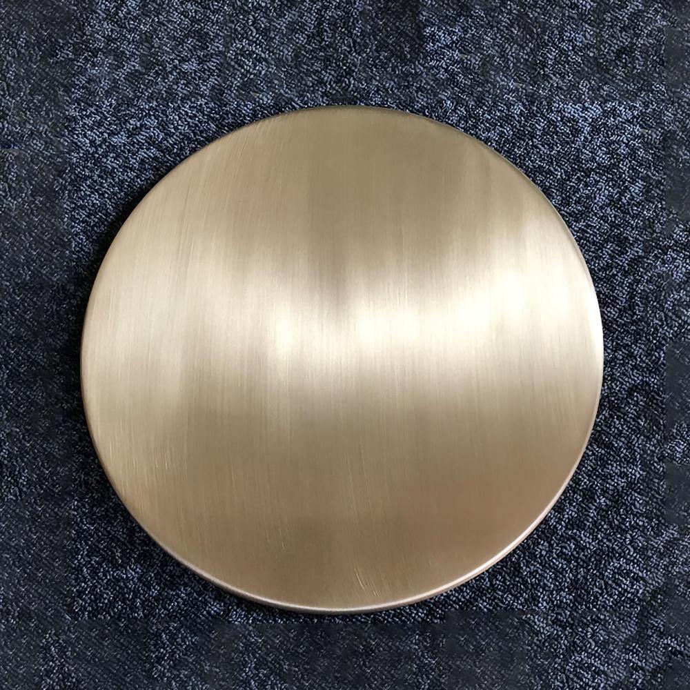 Close-up of brushed gold-coloured disc