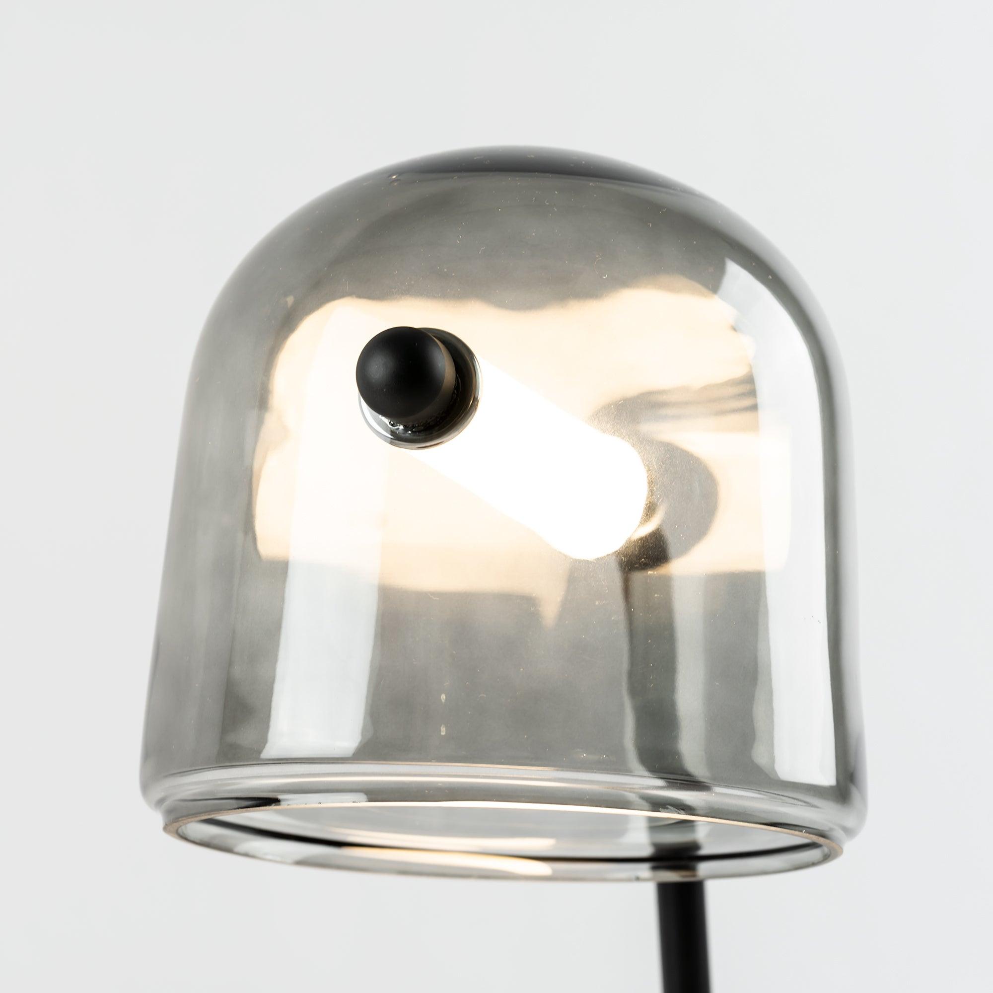 Underside detail of illuminated Mona tube within glass shade