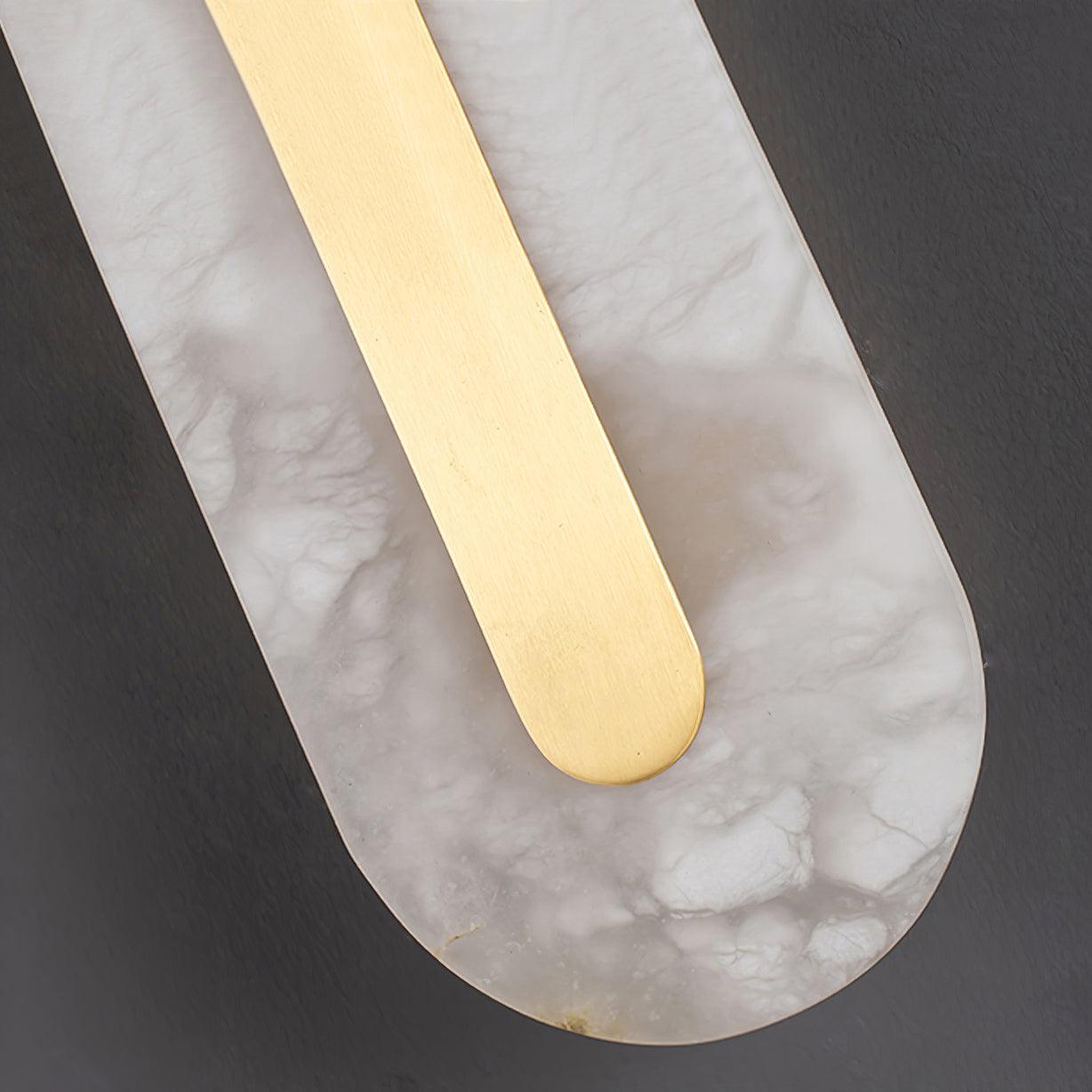 Close-up of alabaster veining and rounded brass detail