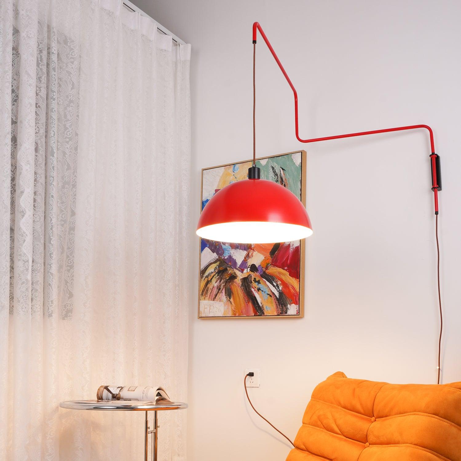 Long red arm and shade beside an orange sofa