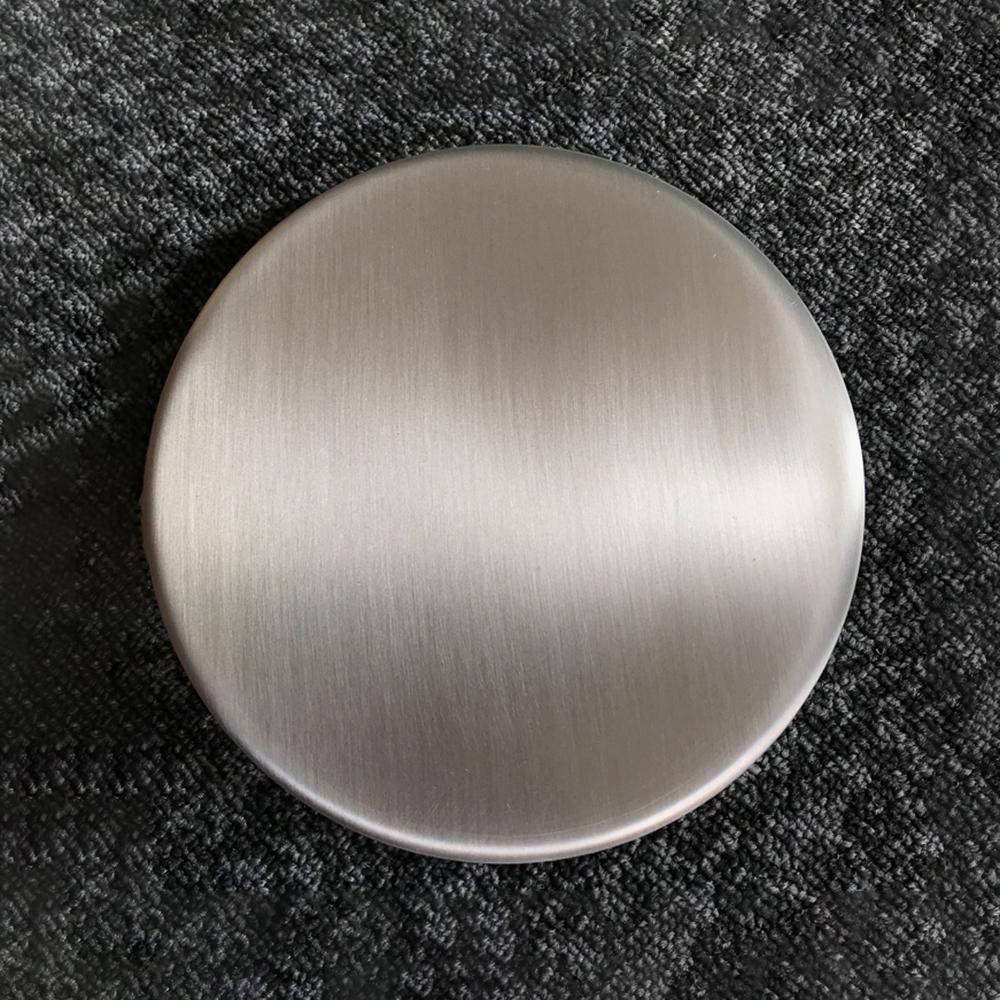 Close-up of brushed silver-coloured disc