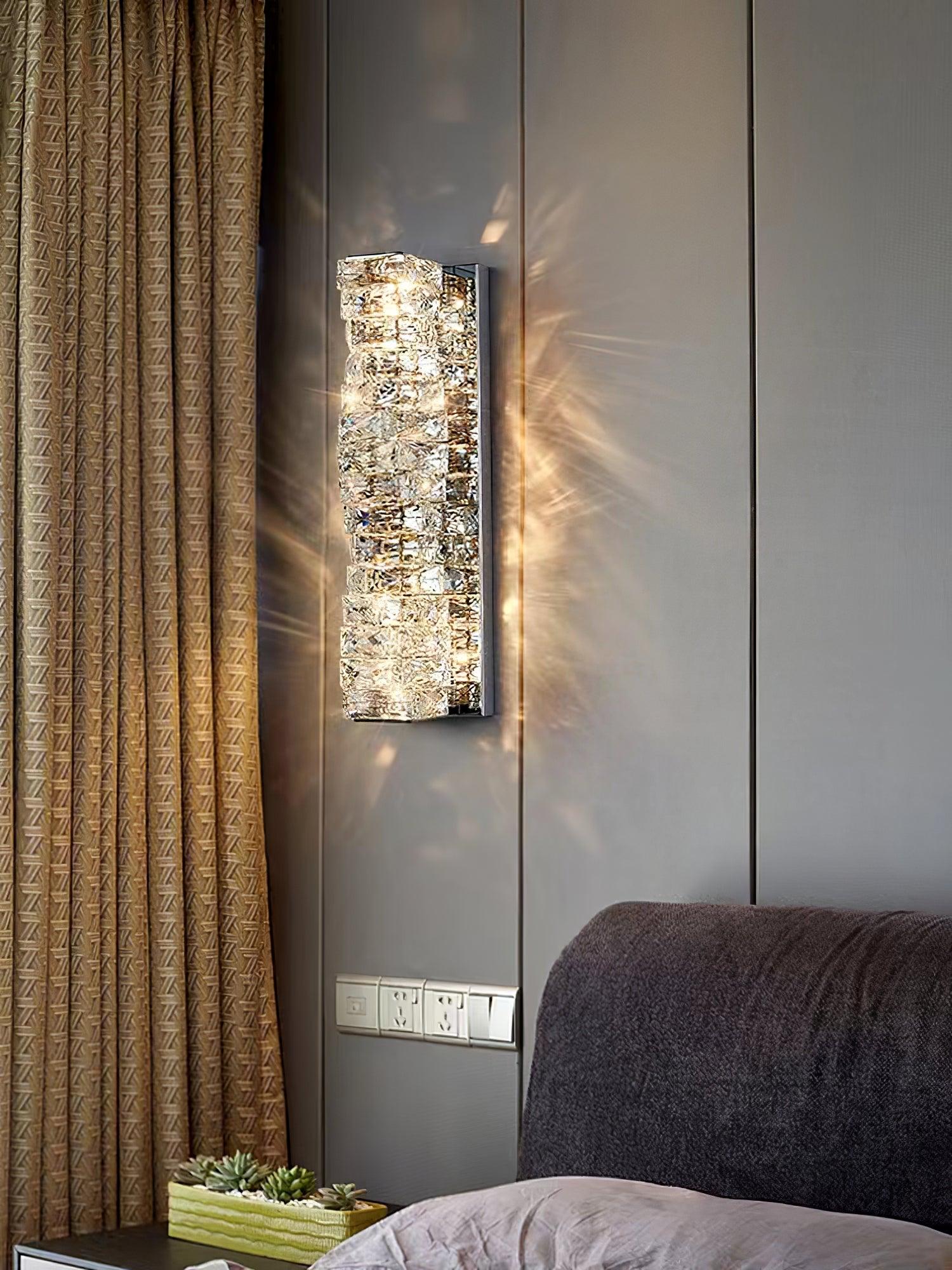 Crystal wall accent beside a bedside cabinet