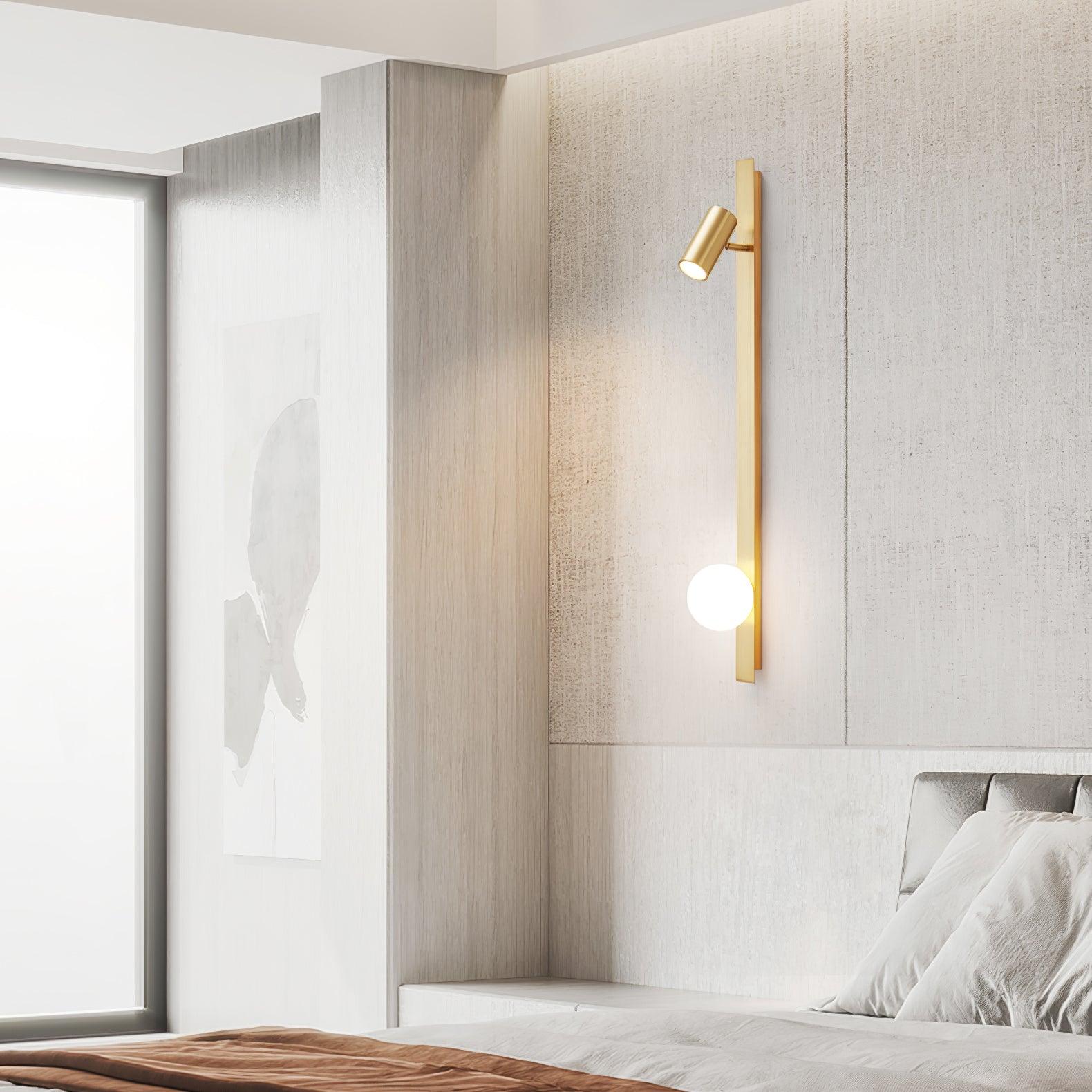 Brass wall bar with White globe beside a bed