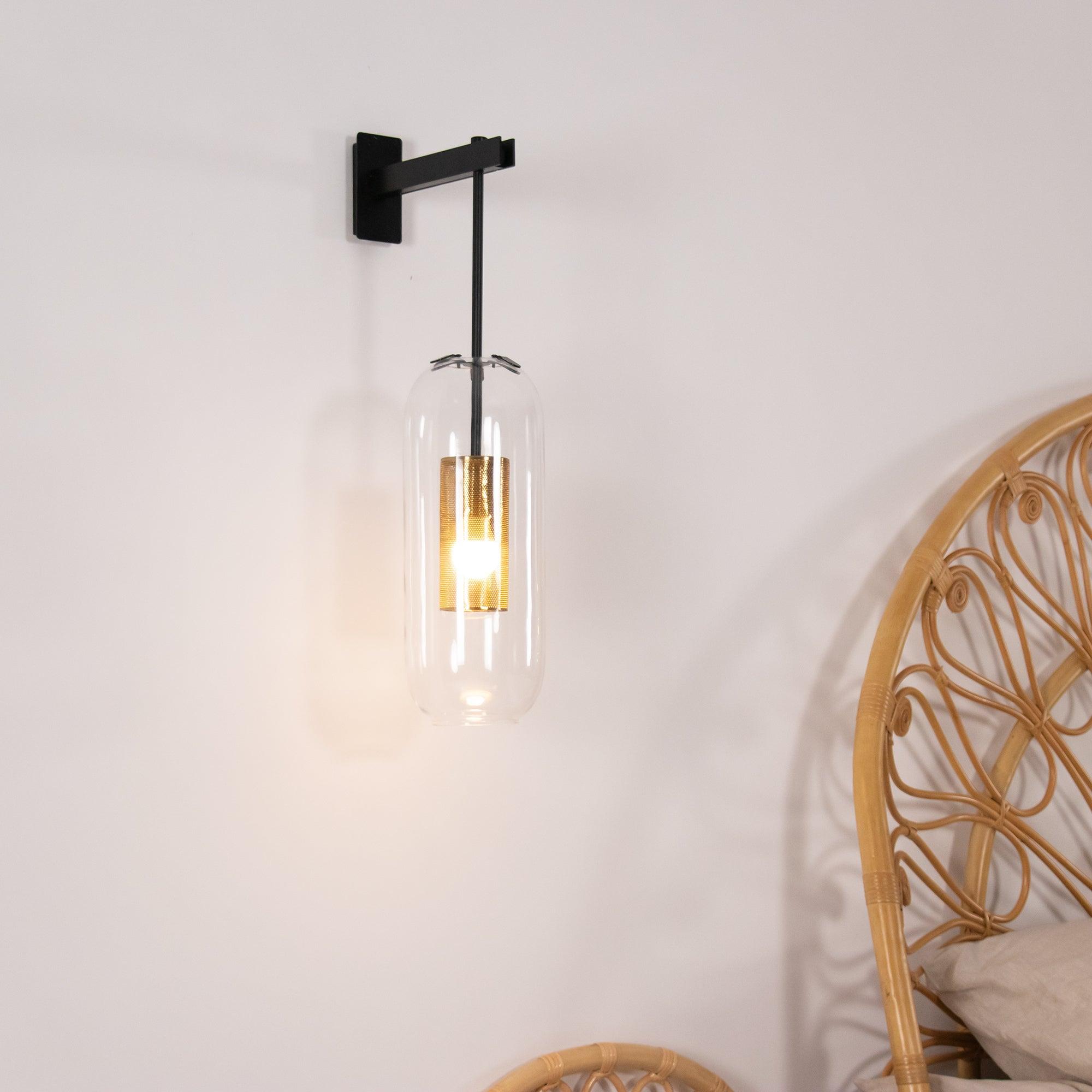 Black wall light next to a woven headboard