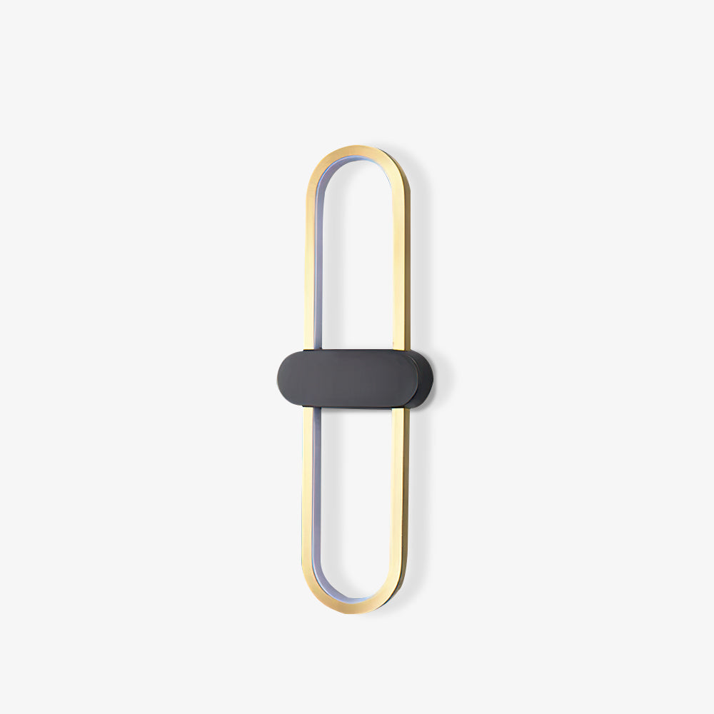 Angled unlit view of the gold oval loop, black horizontal centre and white inner diffuser