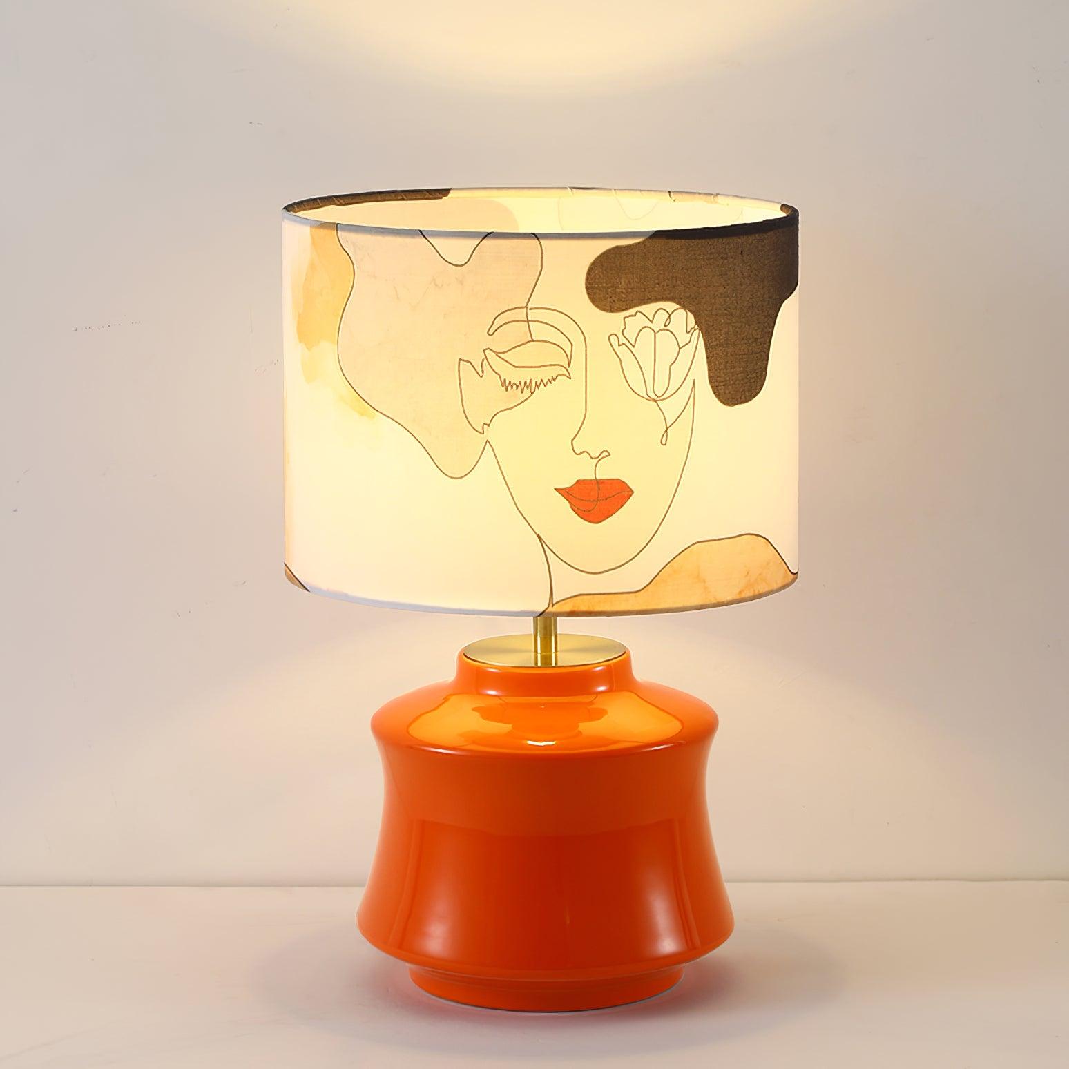 Front view of the illuminated Marilyn face-print shade and Orange body