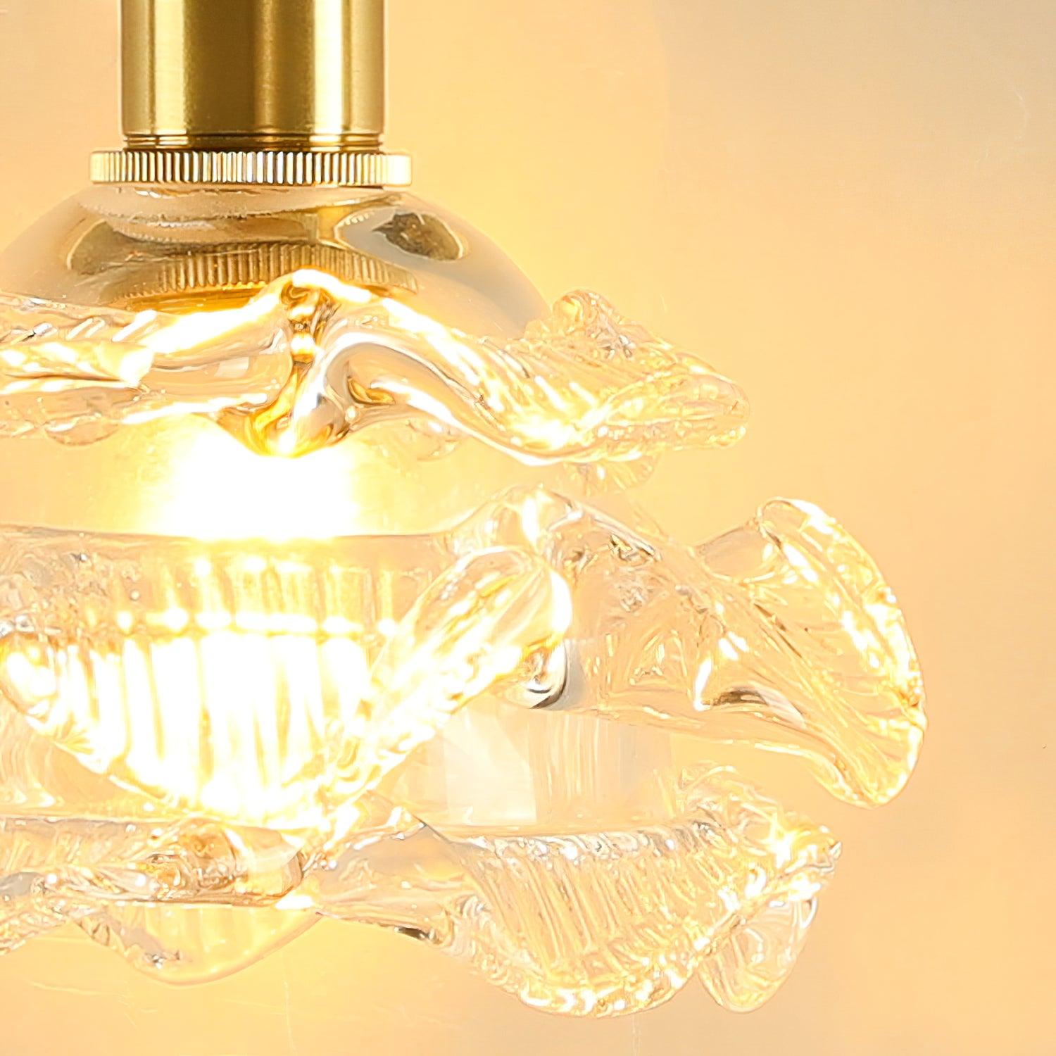 Close-up of wavy clear glass and the knurled brass-coloured ring