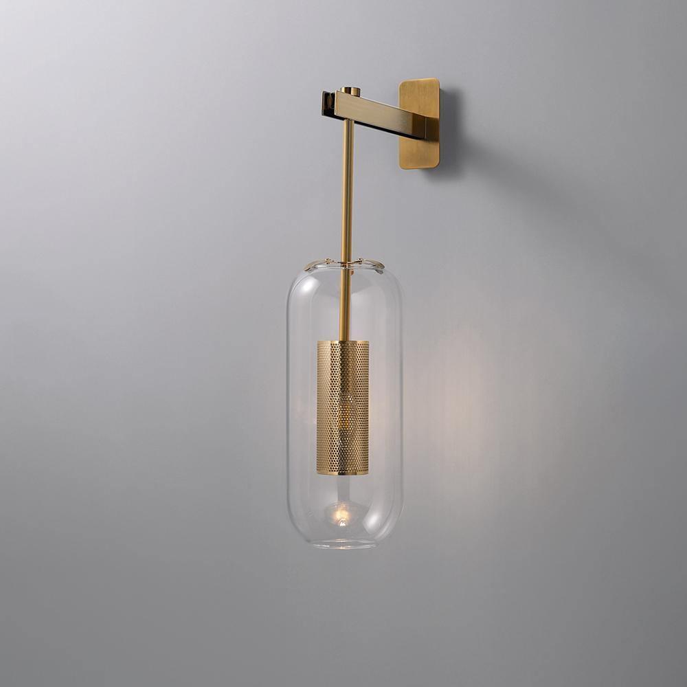 Metallic arm and unlit clear glass capsule