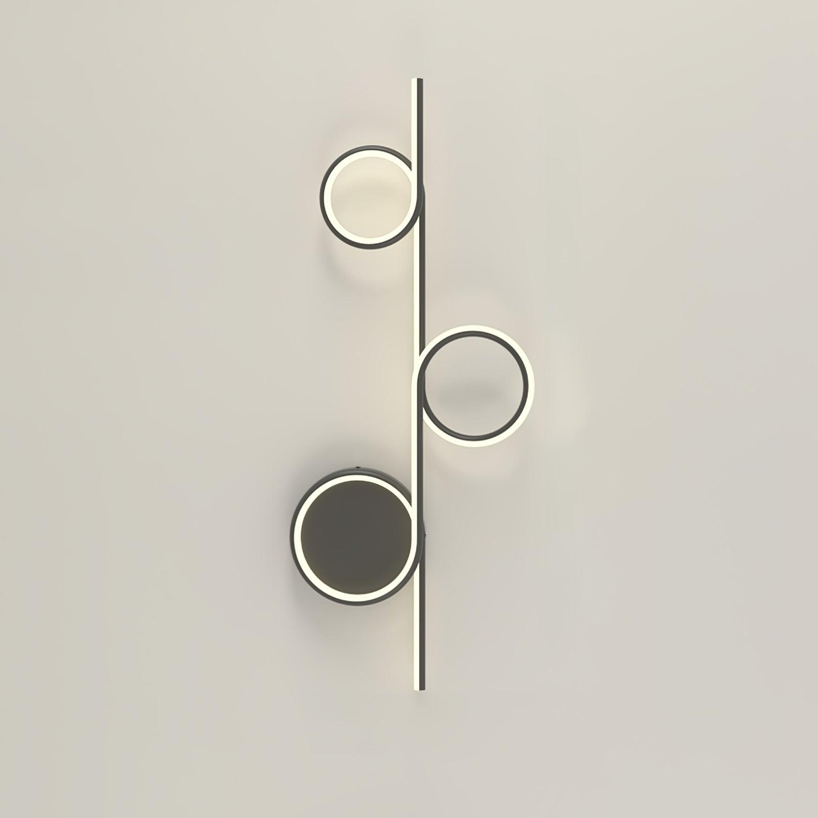 Black Rhythmic Line LED light with three circular elements along the bar