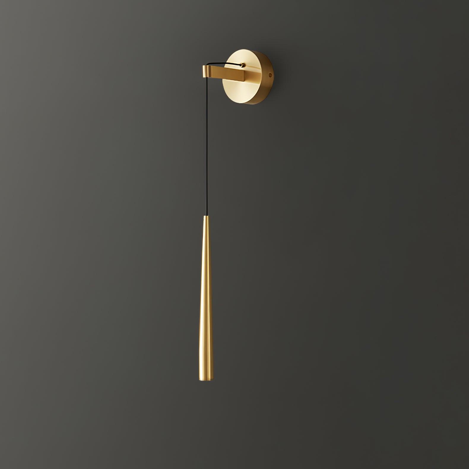 Plain-ended brass-tone taper suspended below a short arm and round wall plate against dark grey