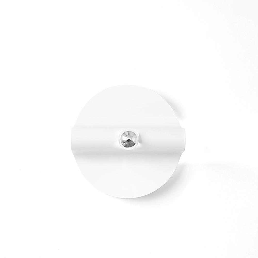 Isolated White single-disc wall light with a raised horizontal fold and central reflective Chrome bulb front against white