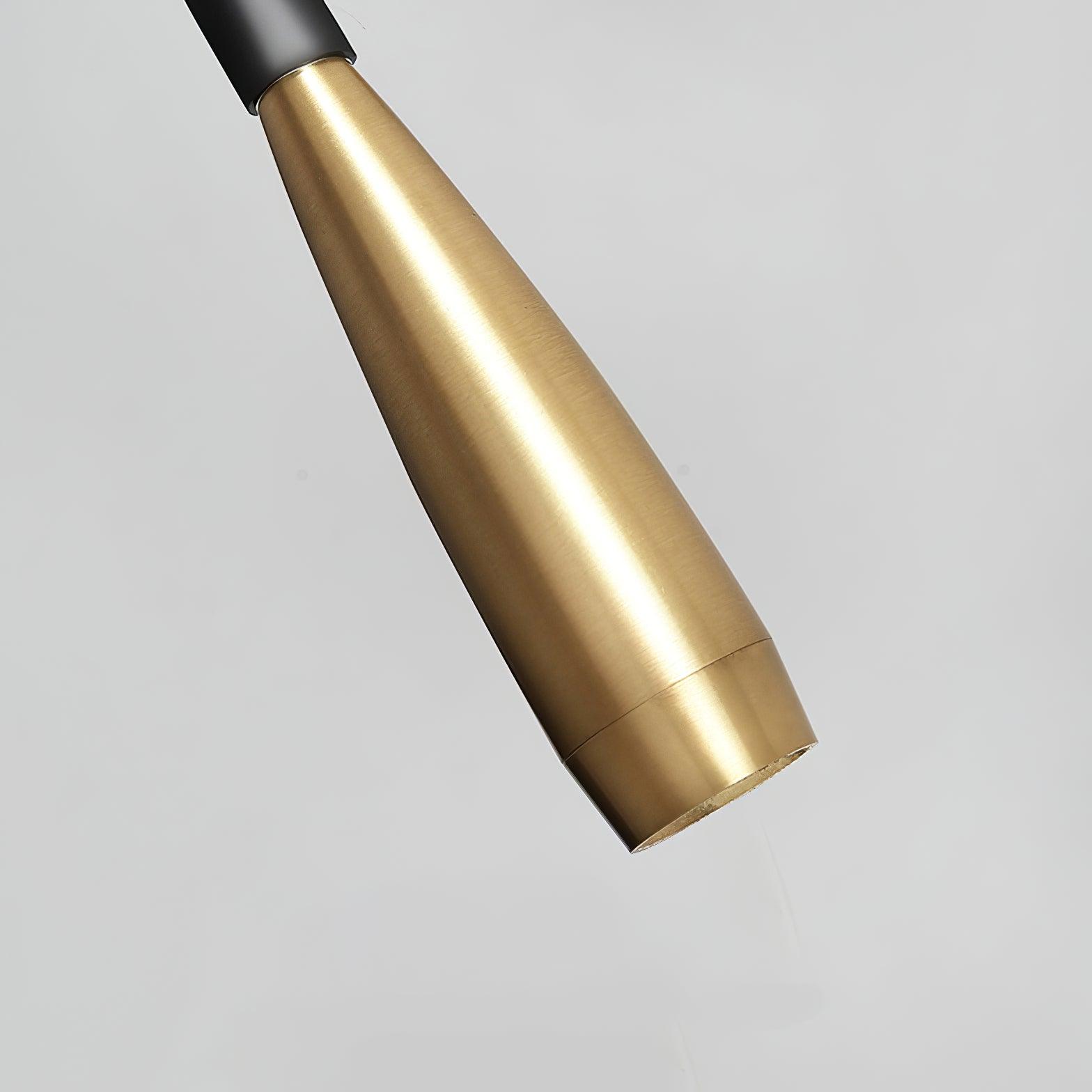 Close tapered brushed gold lamp head showing rim seam and connection to black hose