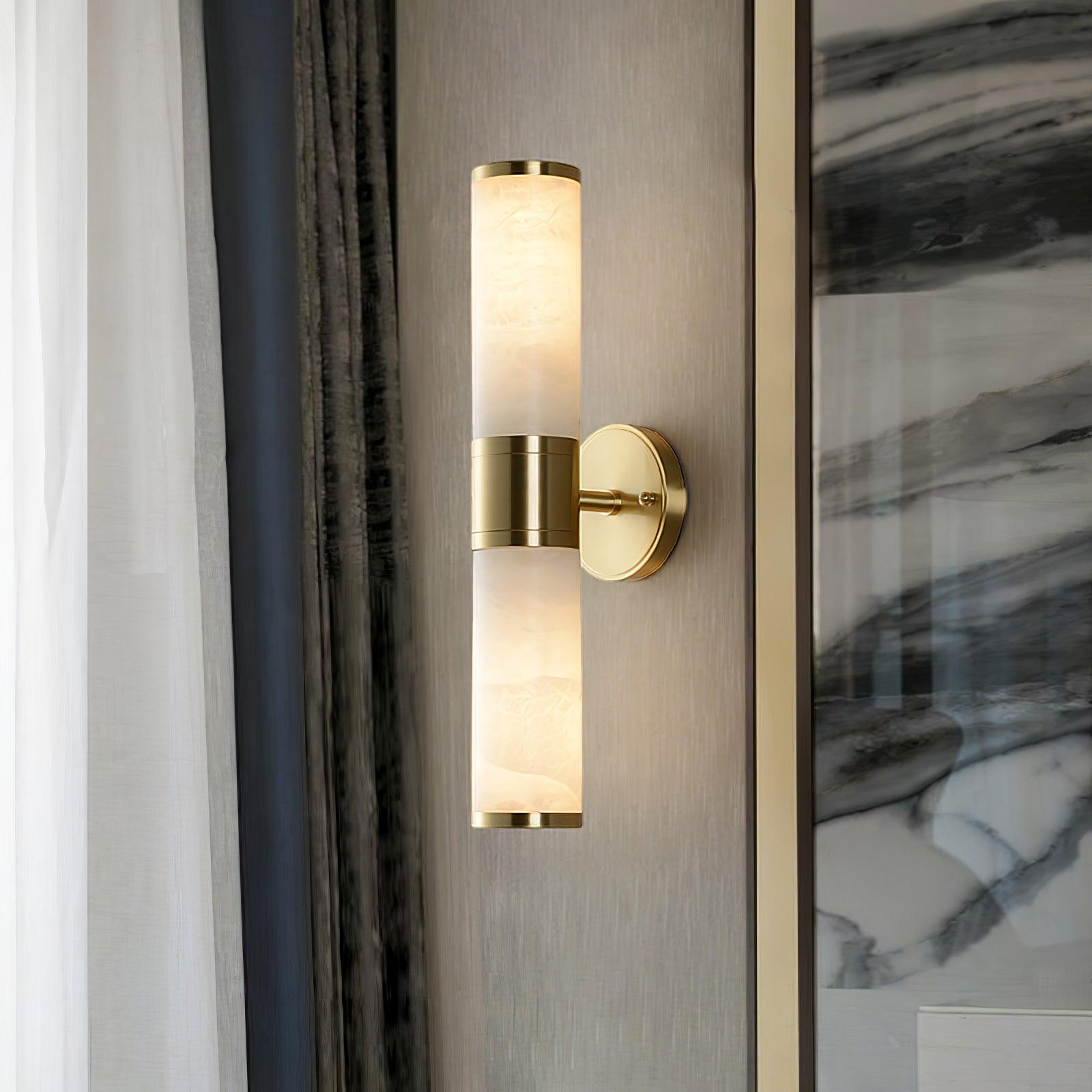 Lampatron double-section wall lamp beside a marble-patterned wall