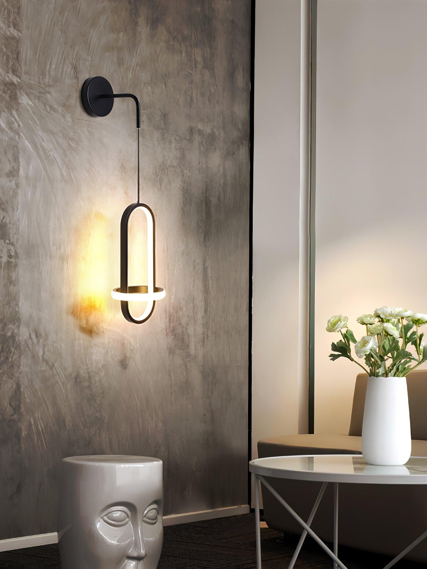 Oval Brass suspended ring LED wall light