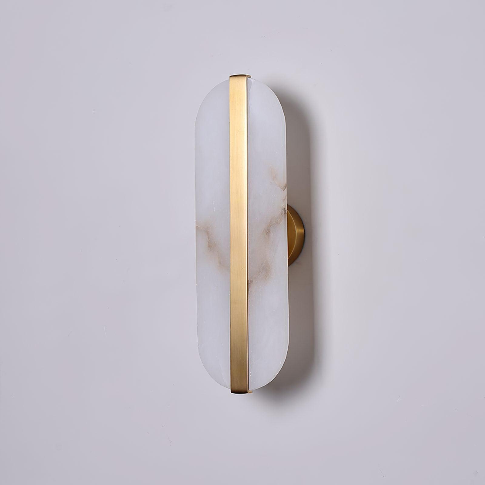 Unlit white alabaster wall sconce with a long brass centre strip and round wall plate