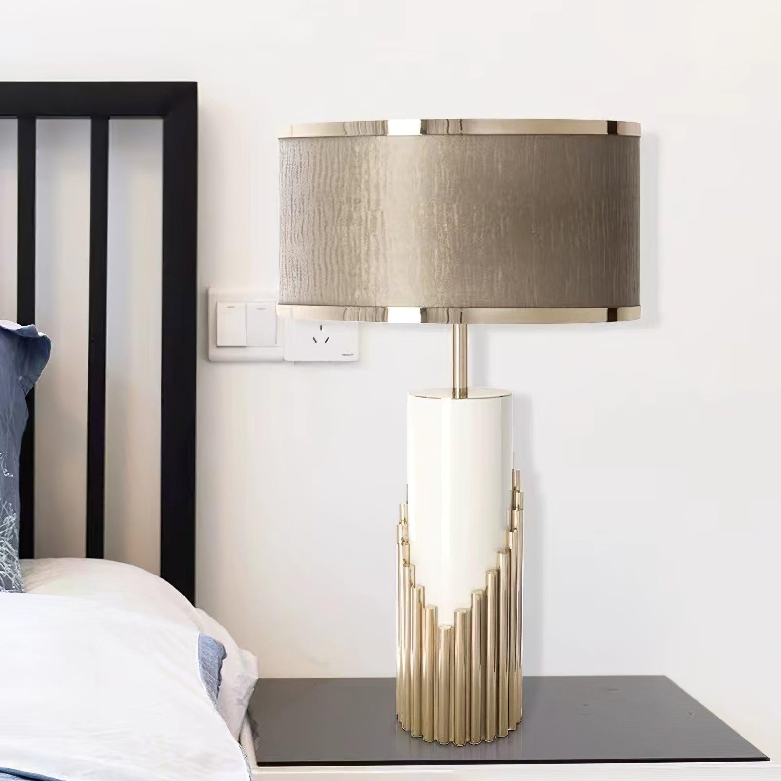 Streamline Gold lamp on a bedside cabinet
