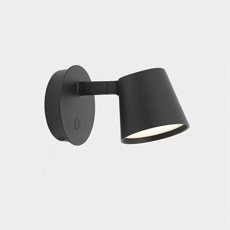 Black Tip fixture on pale square background, with short arm and white illuminated face beneath conical head