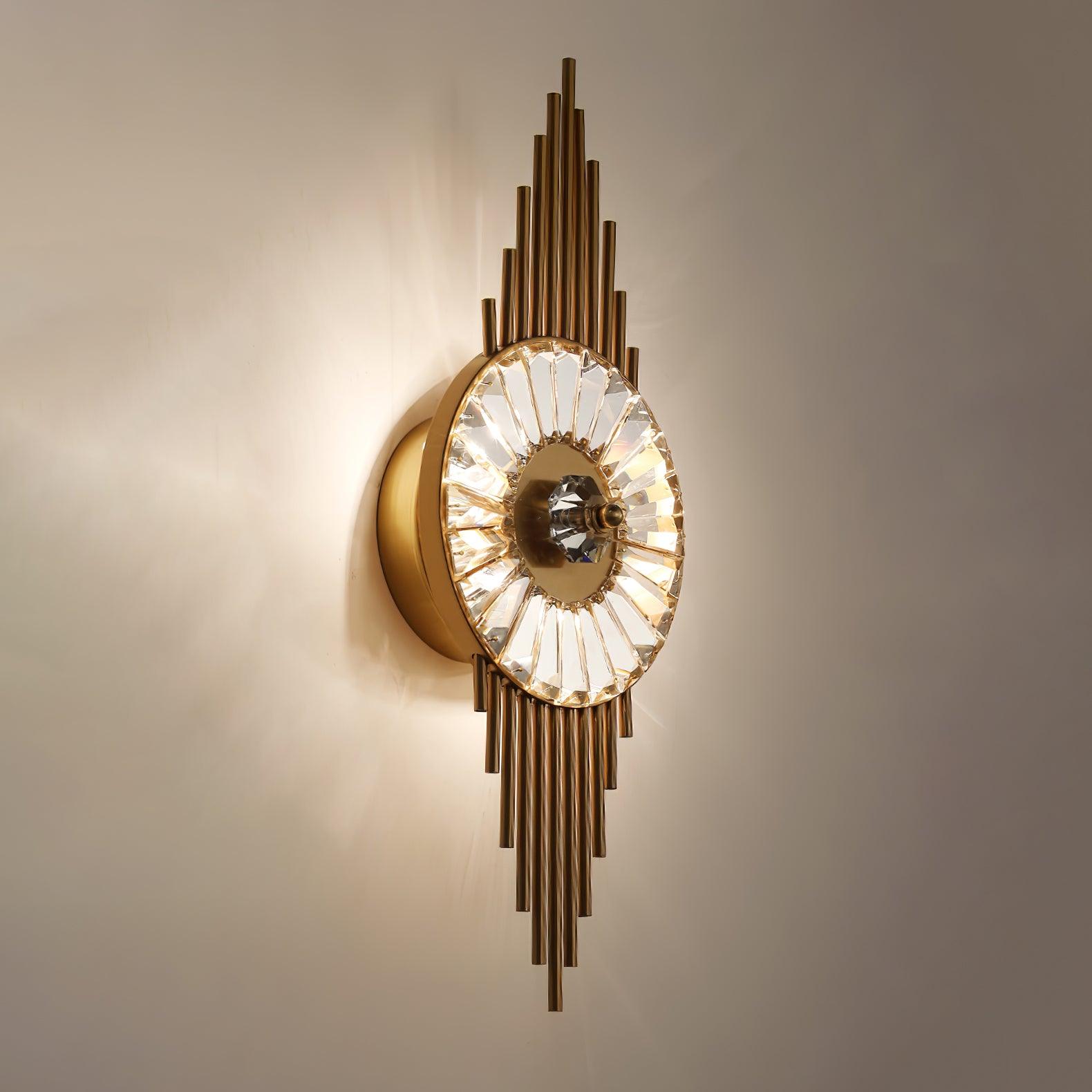 Close oblique view of the lit glass circle, central ornament and gold wall housing