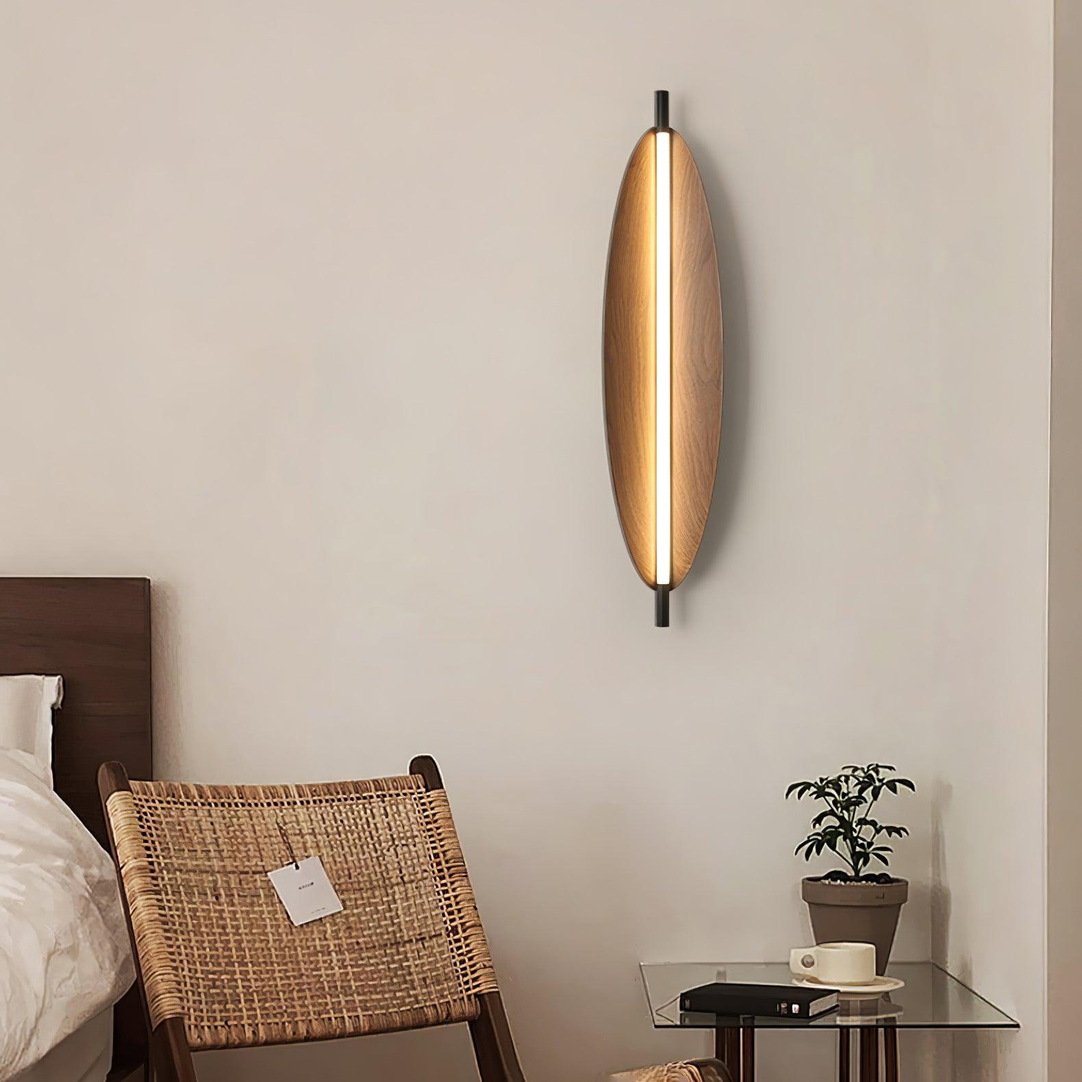 Sleek Board wall sconce with an oval woodgrain-look face and central light strip
